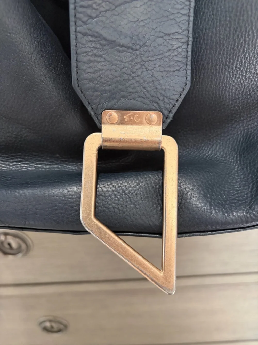 Foley & Corinna Black Leather Shoulder Bag with Modern Gold Accents